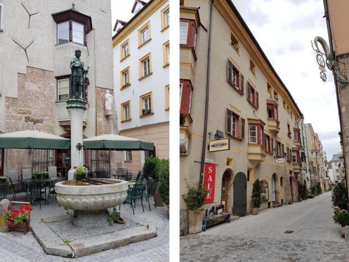 unterwegs in den Gassen von Hall in Tirol vorbei an Brunnen und alten Häusern mit Erkern und Zunftschildern