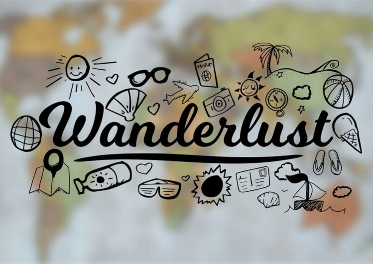 der Text Wanderlust ist umgeben von vielen Reiseutensilien